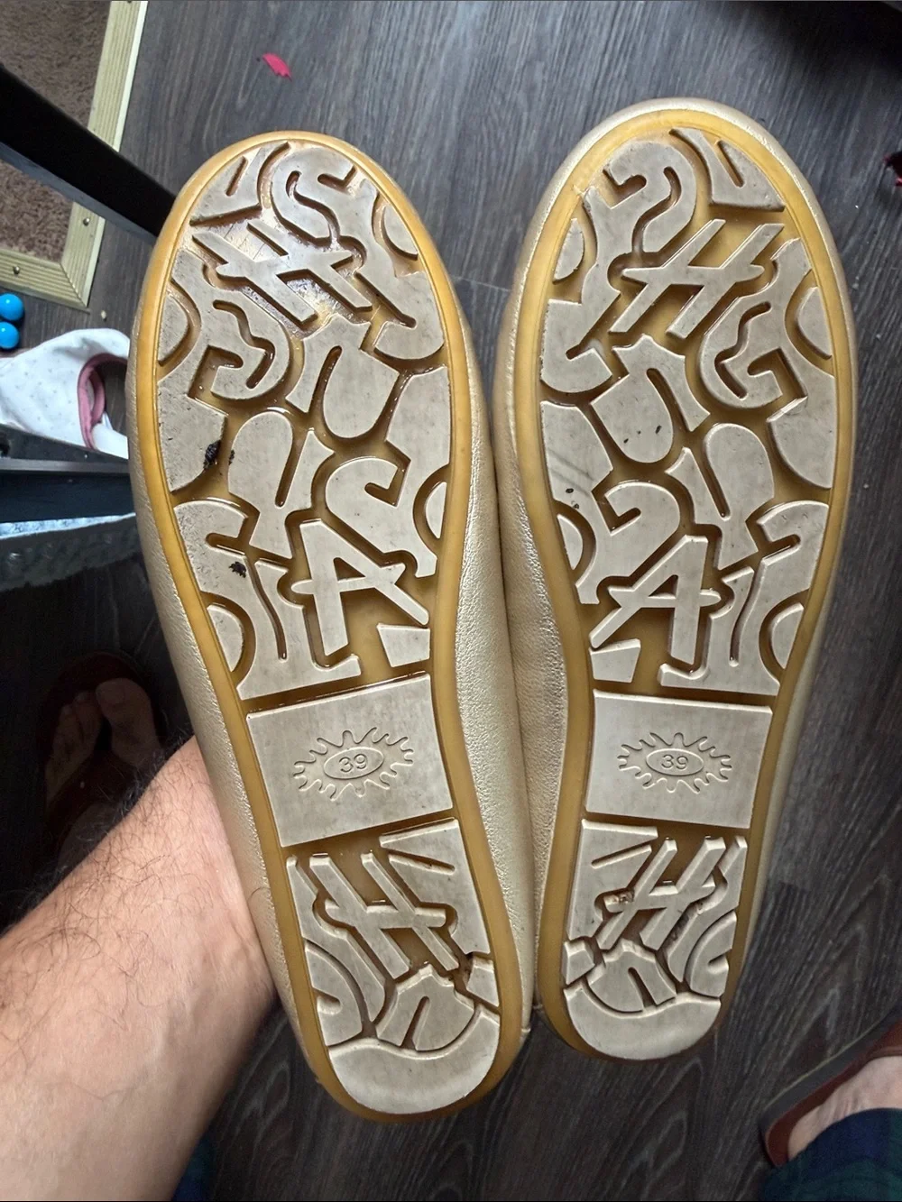 Women gold faux leather moccasin loafers featuring a rounded toe, light
